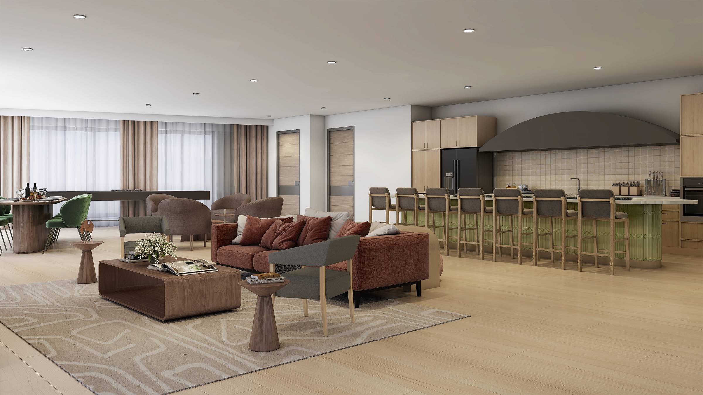 Modern open-plan living room and kitchen with neutral tones, beige rug, red sofa, bar stools, and large windows with sheer curtains.